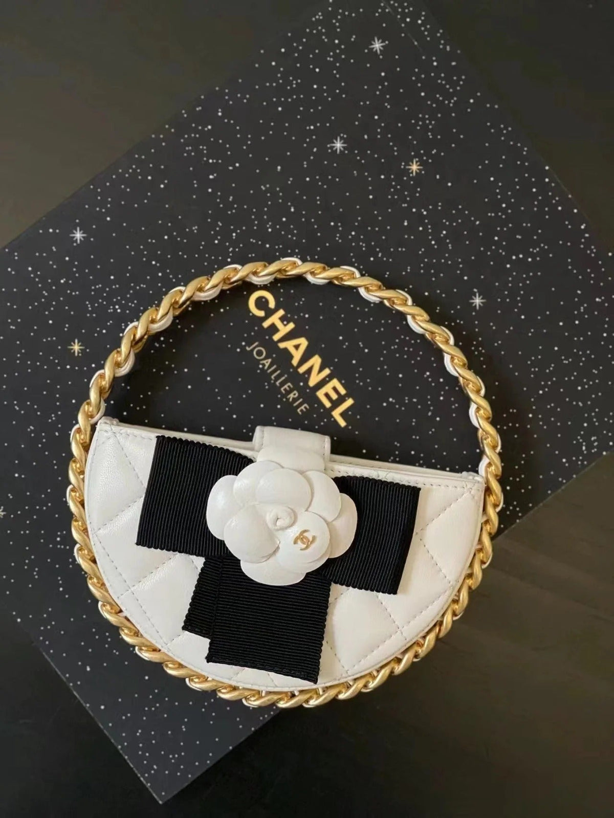 Chanel 2026 Quilted Round Camellia Mini Clutch 16cm Lambskin