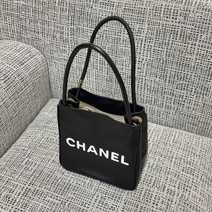 Chanel 2026 Camellia Letter Reversible Tote Bag 25cm Black White Leather