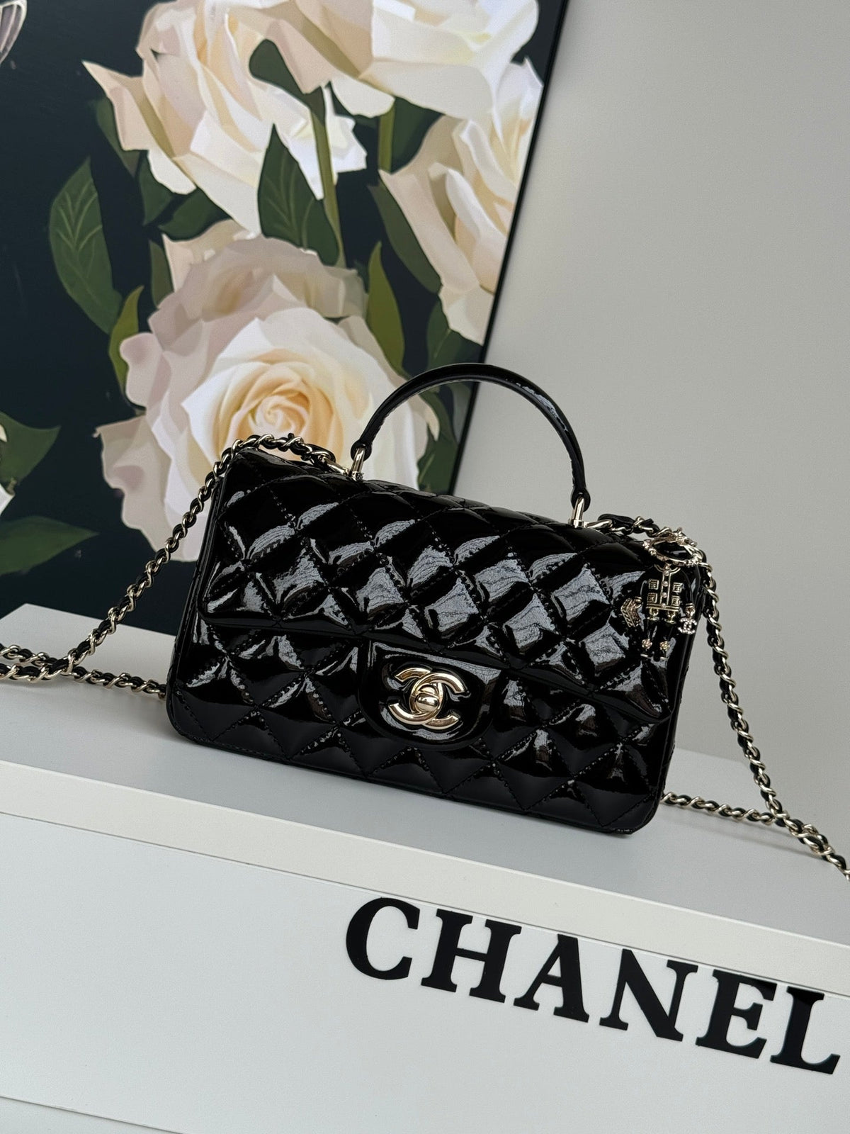 24c mini flap bag 20cm with top handle black patent calfskin