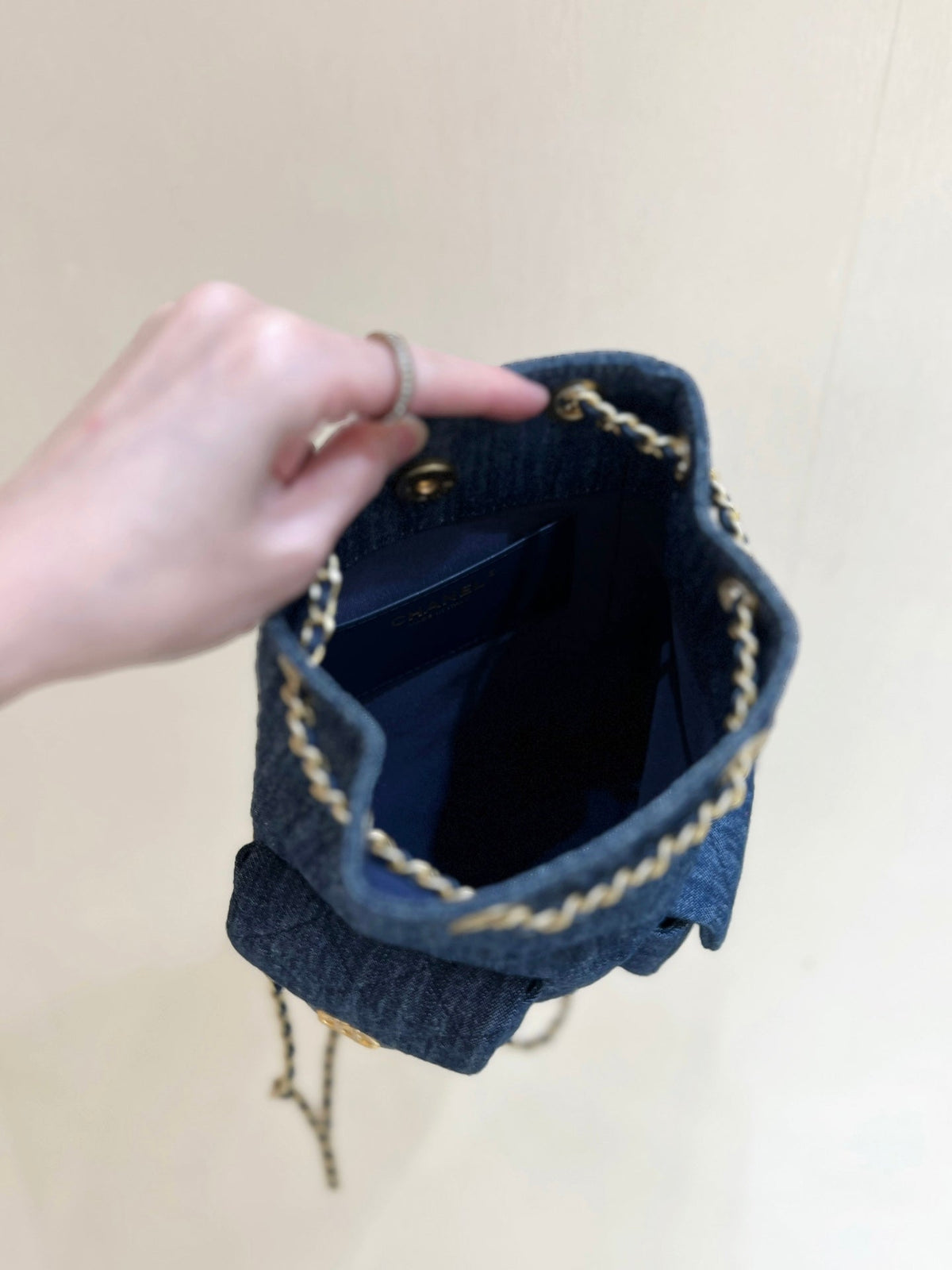DRAWSTRING BUCKET BACKPACK 24 IN DARK BLUE DENIM GOLD HARDWARE